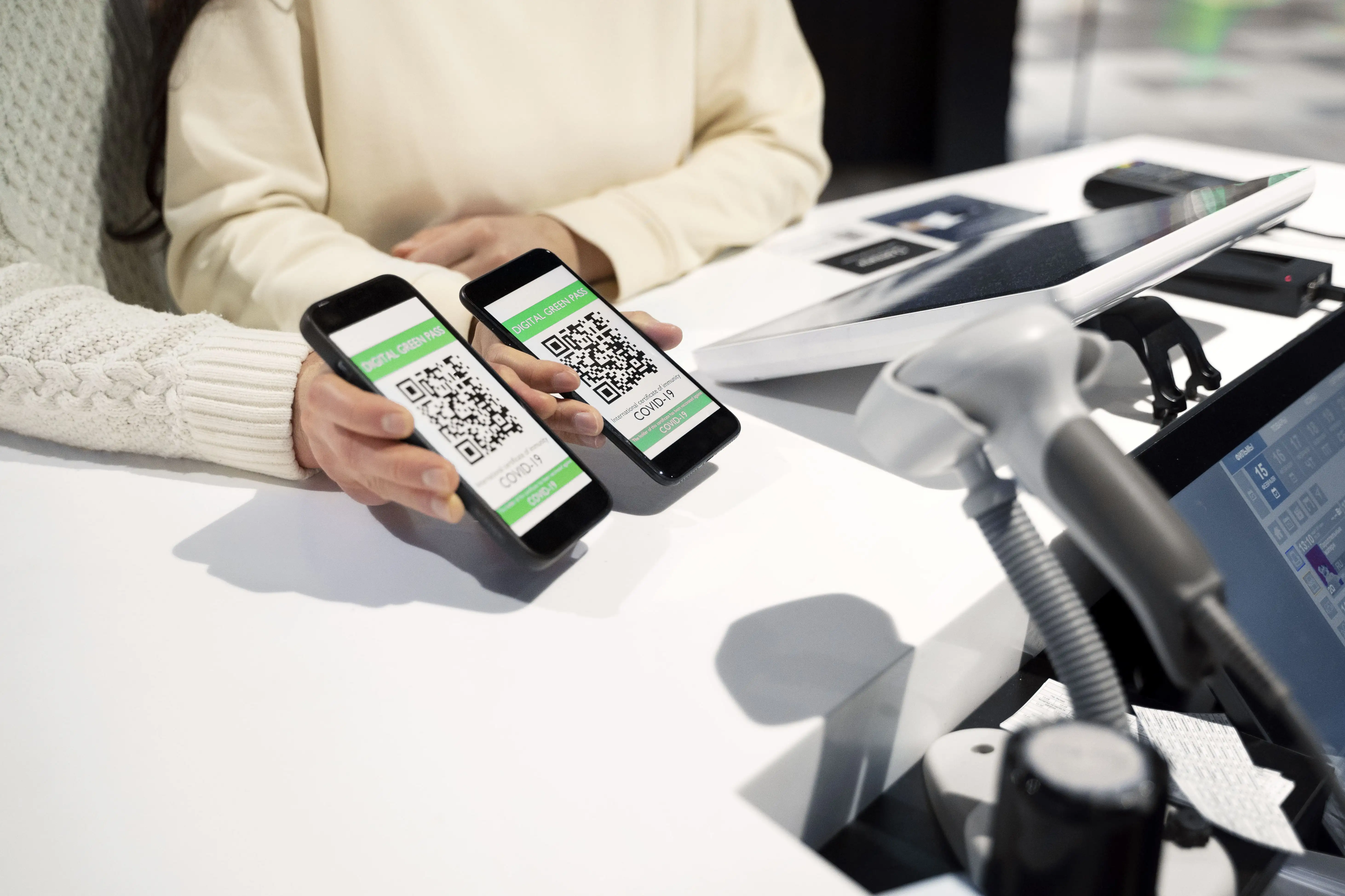 Couple using mobile QR code payment system for contactless business transactions and digital payment processing