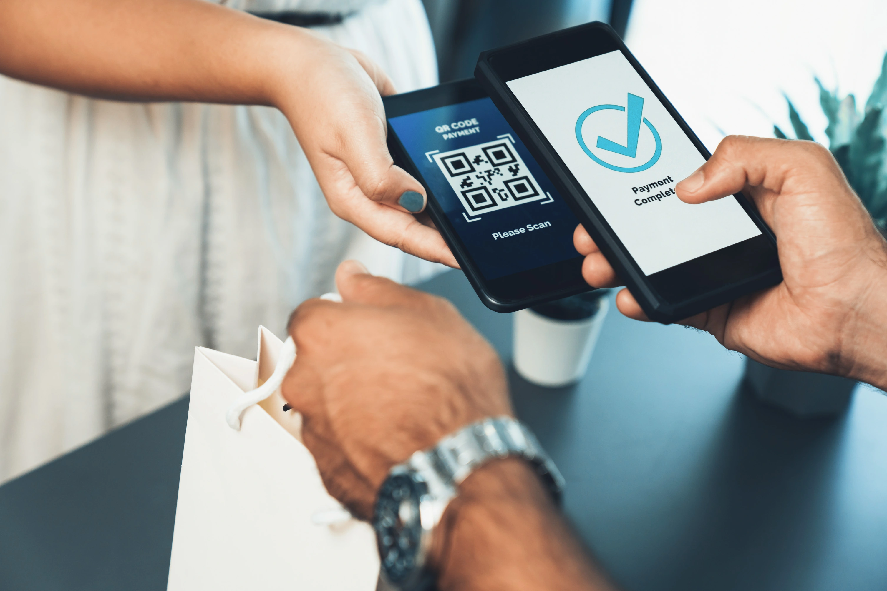 Customer scanning QR code for payment using smartphone — secure digital wallet transaction powered by QR Code Generator.