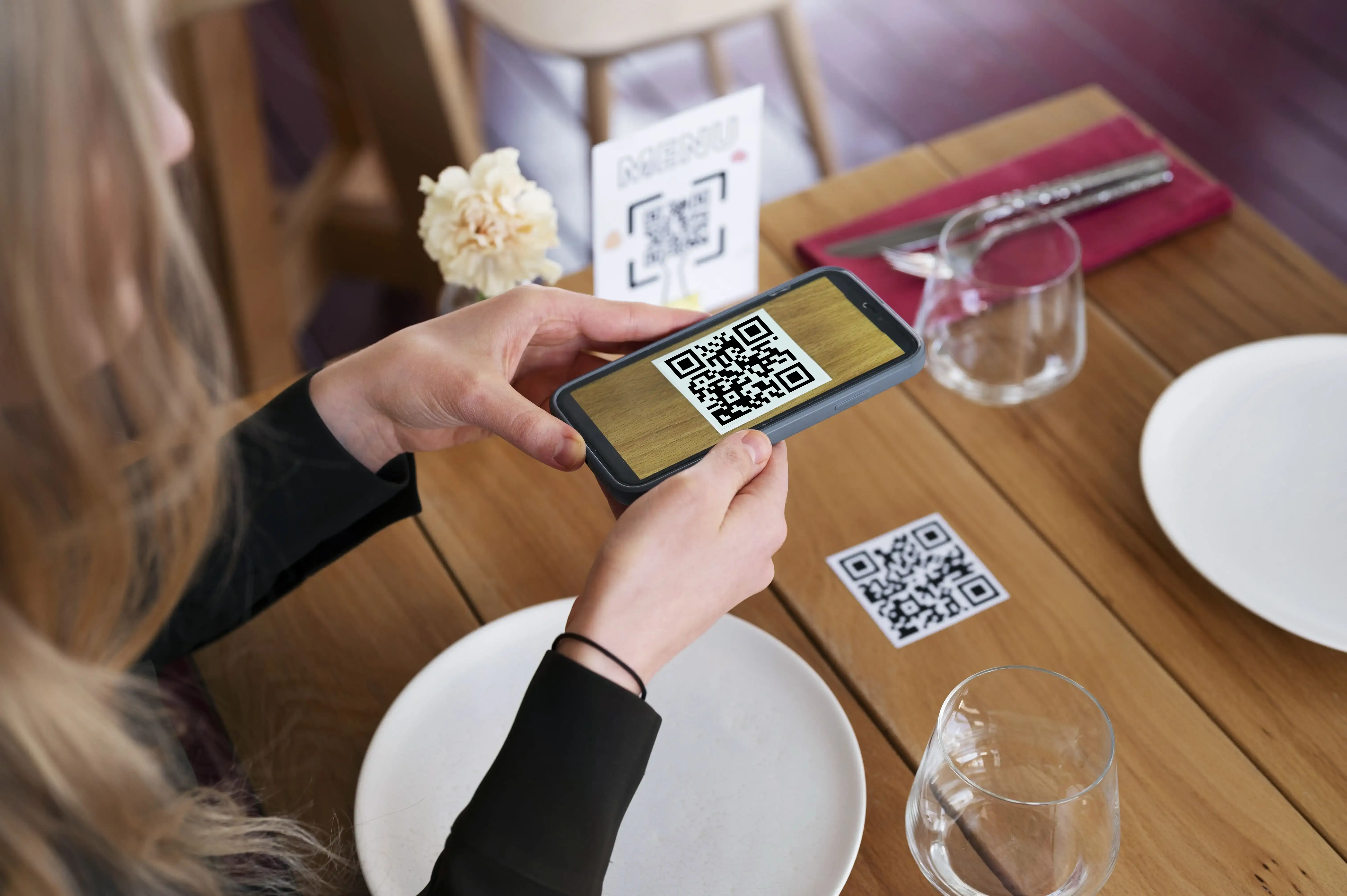 Elegant fine dining restaurant table setting with QR code menu for contactless ordering