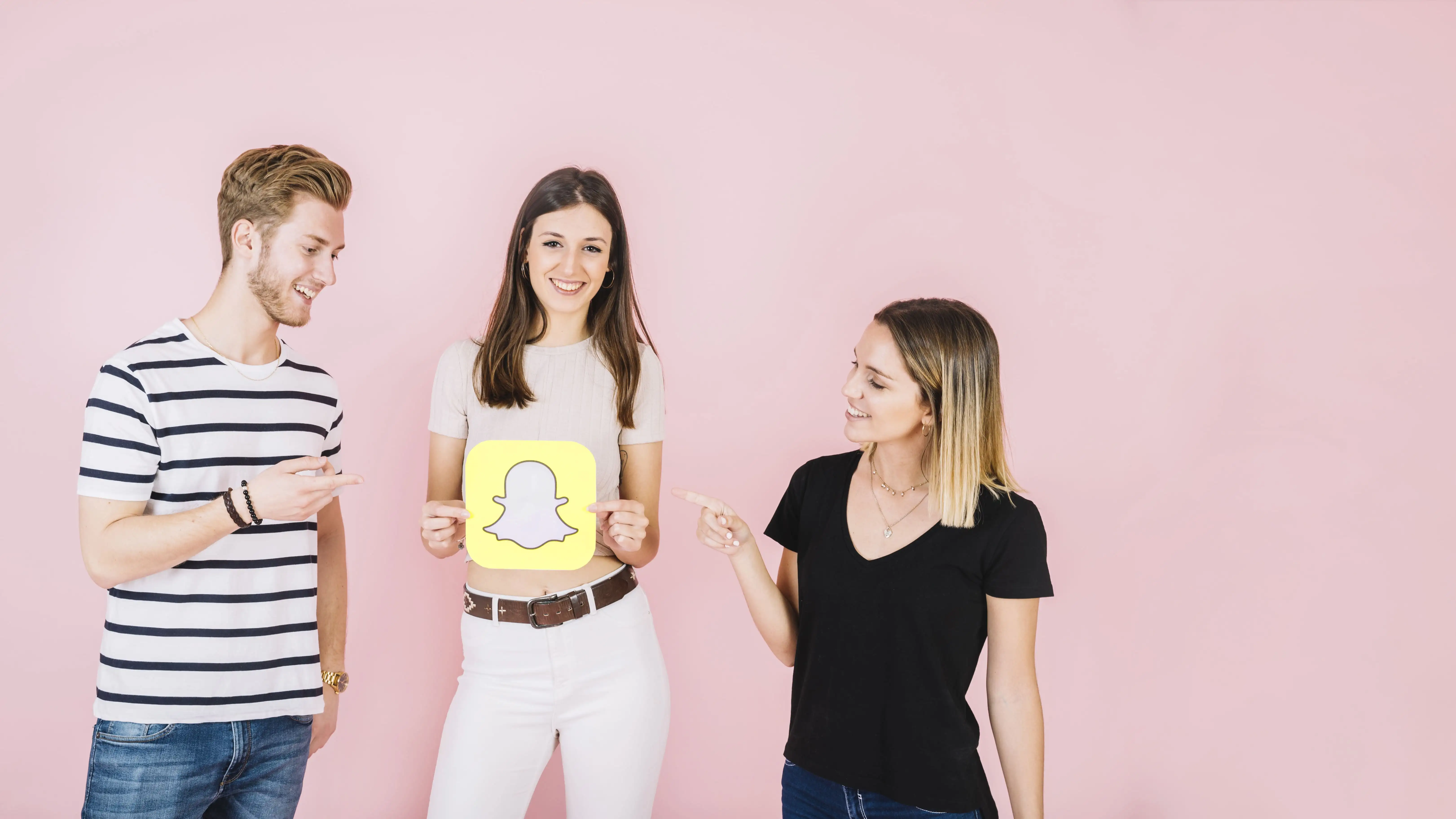 Couple promoting joint social media accounts and collaborative content through QR code marketing strategies