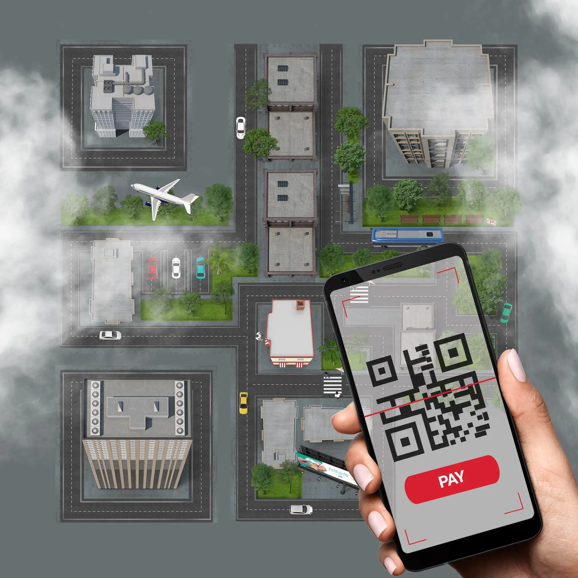 Hand holding smartphone with QR code scanner and red pay button over aerial view of city blocks with buildings, streets, vehicles and airplane for location-based mobile payment and urban navigation