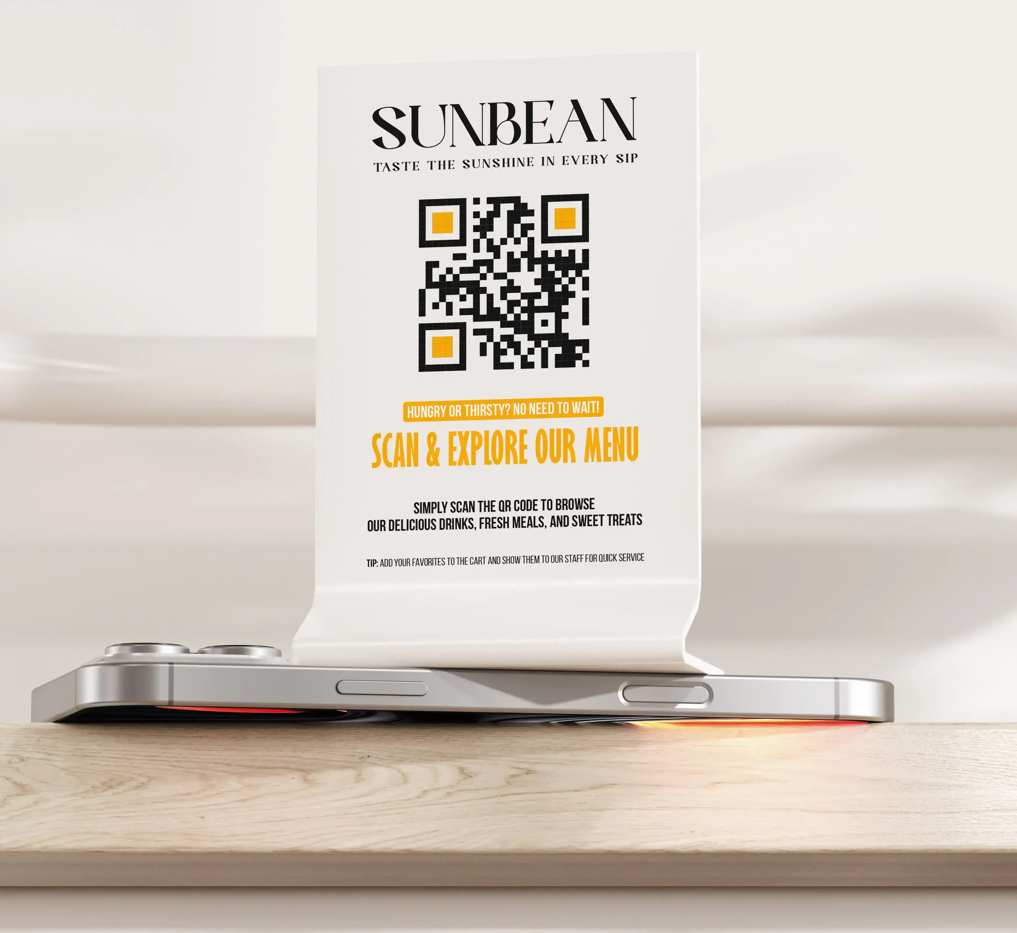 Alt Description: Sunbean branded table tent card with yellow QR code for menu ordering on smartphone, featuring tagline 'Taste the Sunshine in Every Sip' for cafe and restaurant marketing